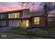 Exterior view of the townhouse showcasing brick facade, garage, and inviting curb appeal at 456 E Arch St, Indianapolis, IN 46202