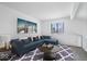 Comfortable living room with a blue sectional sofa, decorative rug, and a bright window at 456 E Arch St, Indianapolis, IN 46202
