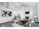 Bright living room with high ceilings, fireplace, modern furniture, and an open view to the dining area at 456 E Arch St, Indianapolis, IN 46202