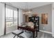 Well-lit home office with a modern desk, stylish lighting, and a large window offering scenic views at 5095 Astor Way, McCordsville, IN 46055