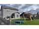 Large backyard featuring a wooden playset, swing set and trampoline with ample room for fun at 530 Farnham Dr, Westfield, IN 46074