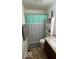 Cozy bathroom with a patterned shower curtain and granite vanity at 530 Farnham Dr, Westfield, IN 46074