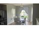 Bright dining area featuring an oval table, white chairs, and a view of the backyard at 530 Farnham Dr, Westfield, IN 46074
