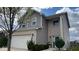 Charming two-story home featuring brick and vinyl siding with an attached two car garage at 530 Farnham Dr, Westfield, IN 46074