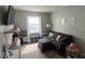 Cozy living room features a dark couch and playful decor at 530 Farnham Dr, Westfield, IN 46074
