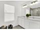 Bright bathroom features dual vanity sinks with modern fixtures, a well-lit mirror, and marble-tiled shower at 5311 Pelion Pl, McCordsville, IN 46055