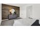 Stylish bedroom featuring modern furniture, a unique accent wall, and neutral color palette at 5311 Pelion Pl, McCordsville, IN 46055