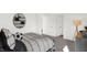 Modern bedroom with sporty theme, featuring unique decor, gray carpet and adjoining rooms at 5311 Pelion Pl, McCordsville, IN 46055