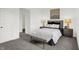 Bright bedroom with a comfortable bed, stylish lamps, and modern decor at 5311 Pelion Pl, McCordsville, IN 46055