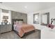 Bright bedroom with stylish décor, including a decorative mirror and coordinated bedside furnishings at 5311 Pelion Pl, McCordsville, IN 46055