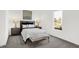Bright bedroom featuring a comfortable bed, stylish lamps, and a view to the outside at 5311 Pelion Pl, McCordsville, IN 46055