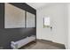 Welcoming entryway with dark accent wall, seating bench, light colored floor, and view of front yard at 5311 Pelion Pl, McCordsville, IN 46055