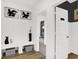Entryway with bench, storage, and modern decor, leading to other rooms in the home at 5311 Pelion Pl, McCordsville, IN 46055