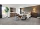 Serene main bedroom featuring stylish furniture, a large window, and a modern accent wall at 5311 Pelion Pl, McCordsville, IN 46055