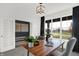 Well-lit study featuring a wooden desk, a grey accent wall, and natural light streaming from the window at 5311 Pelion Pl, McCordsville, IN 46055