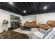 Inviting basement living area with comfortable seating, a large TV, and stylish decor, great for relaxation at 5348 Ashby Ct, Greenwood, IN 46143