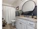 Stylish bathroom featuring granite counters, modern fixtures, and decorative mirror at 5348 Ashby Ct, Greenwood, IN 46143