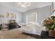 Cozy bedroom with a comfortable bed, soft carpet, and modern décor at 5348 Ashby Ct, Greenwood, IN 46143