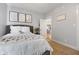 Comfortable bedroom with plush bedding, soft decor, and doorway to another room at 5348 Ashby Ct, Greenwood, IN 46143