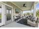 Cozy covered patio with comfortable seating, a ceiling fan, and a mounted TV, great for outdoor relaxation at 5348 Ashby Ct, Greenwood, IN 46143