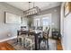 Stylish dining room featuring modern lighting, neutral walls, and coordinated decor for elegant entertaining at 5348 Ashby Ct, Greenwood, IN 46143