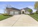 Stunning single-Gathering home with a stone and brick facade, three-car garage, and beautifully landscaped front yard at 5348 Ashby Ct, Greenwood, IN 46143