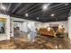Spacious finished basement with dark ceiling, concrete floors, and comfortable seating area, perfect for entertainment at 5348 Ashby Ct, Greenwood, IN 46143