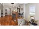 Spacious foyer with hardwood floors, elegant lighting, and a staircase with iron balusters at 5348 Ashby Ct, Greenwood, IN 46143
