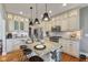 Bright kitchen featuring granite countertops, stainless steel appliances, a large island, and hardwood floors at 5348 Ashby Ct, Greenwood, IN 46143