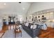 Spacious open-concept living room with hardwood floors, connecting seamlessly to the kitchen and entryway at 5348 Ashby Ct, Greenwood, IN 46143