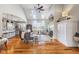 Bright living room with vaulted ceilings, a fireplace, skylights, and hardwood flooring throughout the space at 5348 Ashby Ct, Greenwood, IN 46143