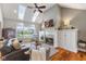Inviting living room with fireplace, vaulted ceiling, skylights, and hardwood floors with great natural light at 5348 Ashby Ct, Greenwood, IN 46143