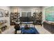 Spacious home office with neutral carpet, dual monitors and shelving on the back wall at 5348 Ashby Ct, Greenwood, IN 46143