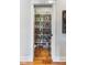 Organized walk-in pantry with plenty of shelving, decor wallpaper, and accessible storage at 5348 Ashby Ct, Greenwood, IN 46143