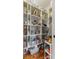 Organized walk-in pantry featuring ample shelving, stylish wallpaper, and well-arranged storage solutions at 5348 Ashby Ct, Greenwood, IN 46143