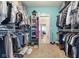 Organized walk-in closet features ample shelving and hanging space for clothes and accessories at 5348 Ashby Ct, Greenwood, IN 46143