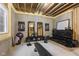 Unfinished basement workout area featuring exposed ceiling and weights, designed for fitness and exercise at 5348 Ashby Ct, Greenwood, IN 46143