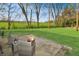 Cozy backyard patio with fire pit and seating area, perfect for outdoor entertaining at 575 Everling Dr, Morgantown, IN 46160