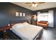 Comfortable bedroom with dark walls, queen-size bed, and decorative furnishings, offering a serene retreat at 575 Everling Dr, Morgantown, IN 46160
