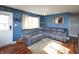 Inviting living room with a plush sectional sofa, hardwood floors, and a cozy ambiance, great for relaxation at 575 Everling Dr, Morgantown, IN 46160
