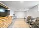 Finished basement with neutral walls, carpeting, and a television entertainment center at 5817 Beechwood Ave, Indianapolis, IN 46219