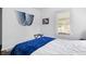 Bright bedroom featuring large window with exterior views and blue and white decor at 5817 Beechwood Ave, Indianapolis, IN 46219