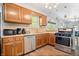 Spacious kitchen featuring wood cabinets and stainless steel appliances at 5817 Beechwood Ave, Indianapolis, IN 46219