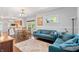 Open-concept living area with a dining space and hardwood floors, seamlessly connected to the kitchen at 5817 Beechwood Ave, Indianapolis, IN 46219