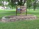 The Ellenberger Park sign is surrounded by beautiful landscaping and lush green grass at 5817 Beechwood Ave, Indianapolis, IN 46219