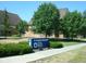 The Irvington Branch Indianapolis Marion County Public Library features a blue sign and beautiful landscaping at 5817 Beechwood Ave, Indianapolis, IN 46219