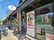 A charming restaurant exterior with outdoor seating, a clear view of the front entrance and visible signage at 5817 Beechwood Ave, Indianapolis, IN 46219