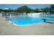 A large swimming pool with a diving board and lounge chairs offers plenty of room for relaxation at 5817 Beechwood Ave, Indianapolis, IN 46219