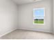 Bright bedroom featuring a large window with views of the community at 5964 Lomita Ave, Plainfield, IN 46168