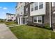 A lovely townhome with stone and siding, a well manicured lawn, and an inviting entrance at 5964 Lomita Ave, Plainfield, IN 46168